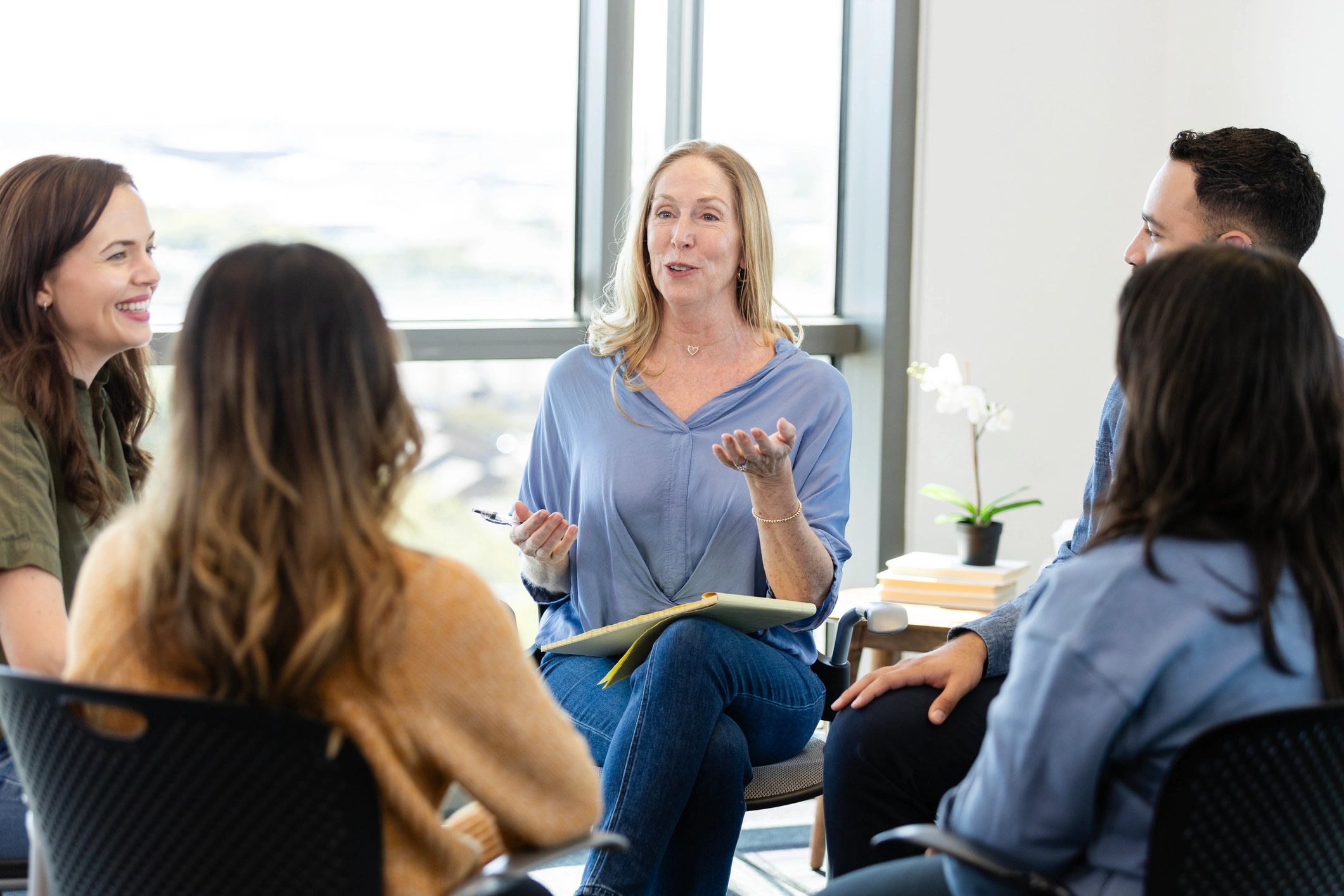 Therapist leading a group support session